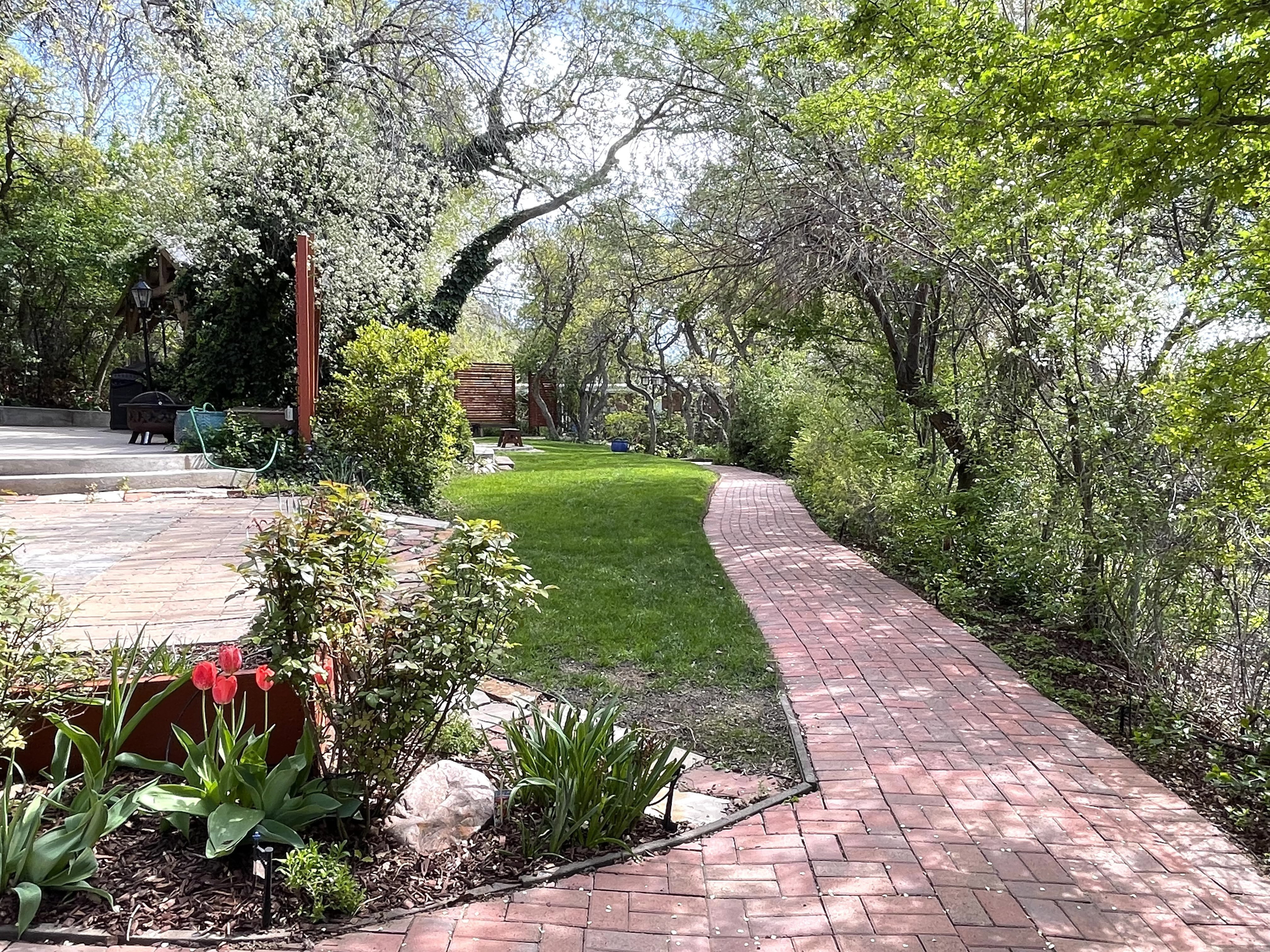 View of green lawn with a deck