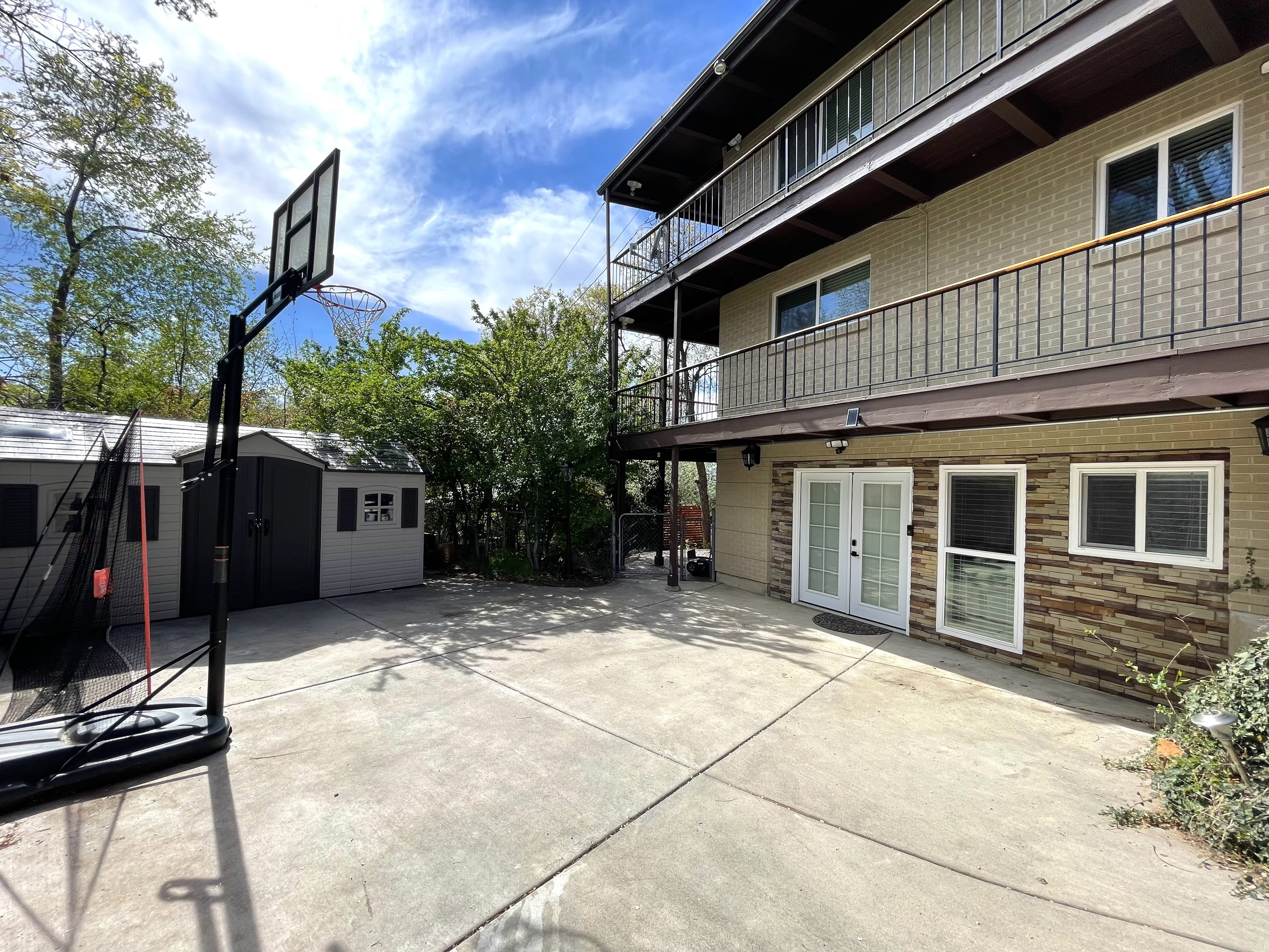 Patio / terrace with french doors, a patio area, and a storage unit