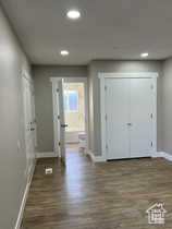 Foyer entrance featuring dark wood finished floors and recessed lighting