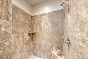 Full bathroom featuring tiled shower