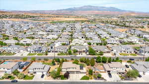 Aerial perspective of suburban area with a mountainous background