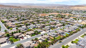 Aerial perspective of suburban area featuring a mountain backdrop