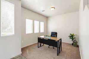 Office with light colored carpet