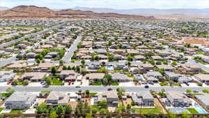 Aerial view of residential area with a mountainous background