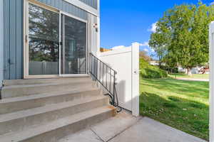 Property entrance with a yard