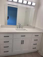 Bathroom featuring vanity and light wood-type flooring