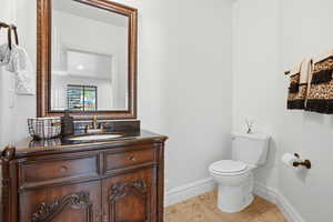 Bathroom with vanity and light tile patterned floors