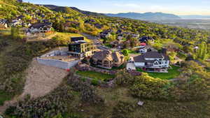 Aerial perspective of suburban area with a mountainous background