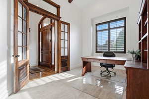 Office featuring light carpet and baseboards