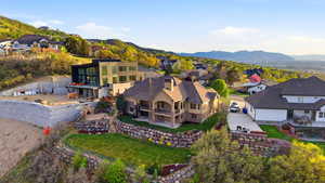 Aerial view of residential area featuring a mountain backdrop