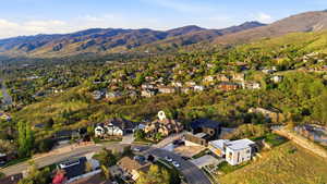 Aerial perspective of suburban area with a mountainous background
