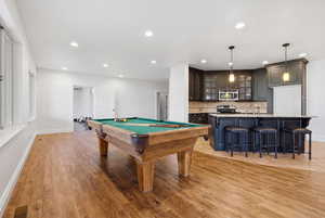 Recreation room featuring billiards, light wood-style flooring, and recessed lighting
