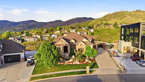 Aerial perspective of suburban area featuring a mountainous background