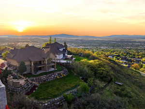 View of subject property with a mountain backdrop