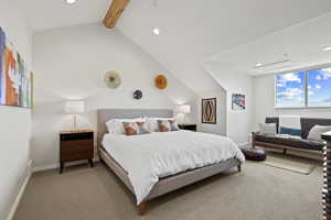 Carpeted bedroom featuring recessed lighting and beam ceiling