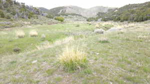 View of mountain backdrop with rural landscape