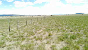 Water view with rural landscape and a mountainous background