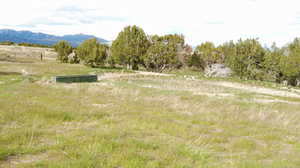 View of mountain backdrop featuring rural landscape
