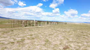 View of yard with a rural view and a mountain view