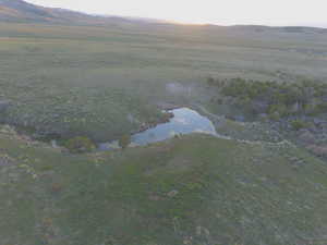 Aerial view of sparsely populated area with a water and mountain view