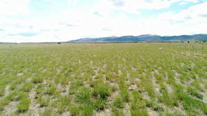 View of mountain backdrop featuring rural landscape