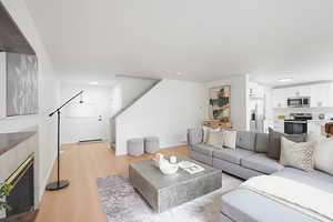 Living room featuring a fireplace and light wood finished floors