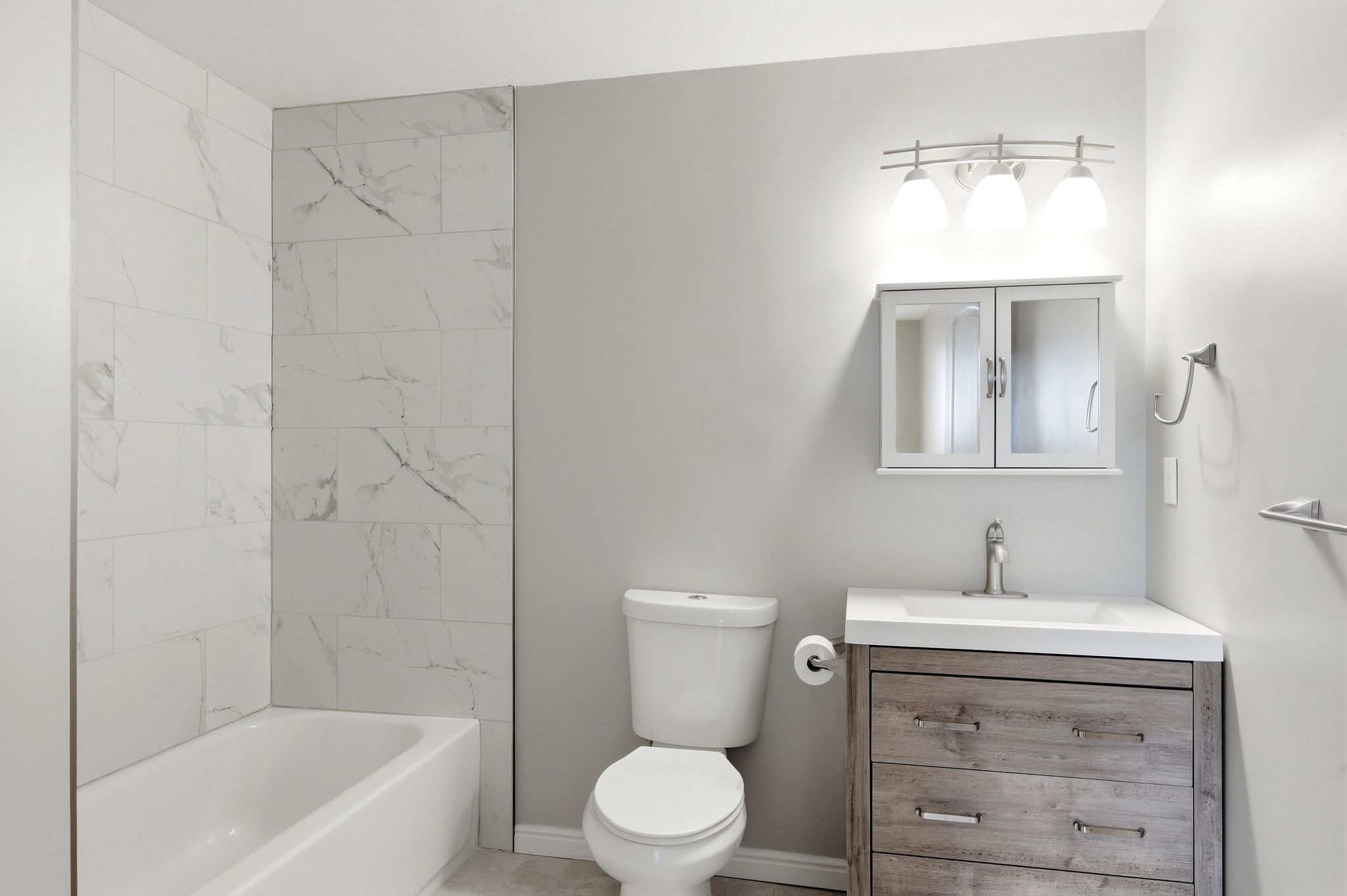 Full bathroom featuring vanity and tub / shower combination