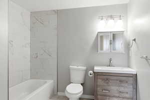 Full bathroom featuring vanity and tub / shower combination