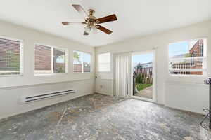 Unfurnished room with a baseboard radiator and ceiling fan