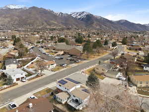 Aerial overview of property's location with nearby suburban area and mountains