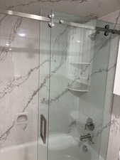 Full bath with enclosed tub / shower combo