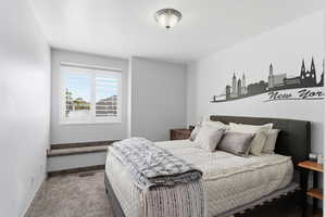 Carpeted bedroom with baseboards