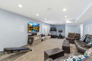Living room with carpet flooring and recessed lighting