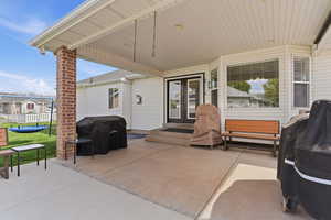 View of patio featuring a grill and french doors