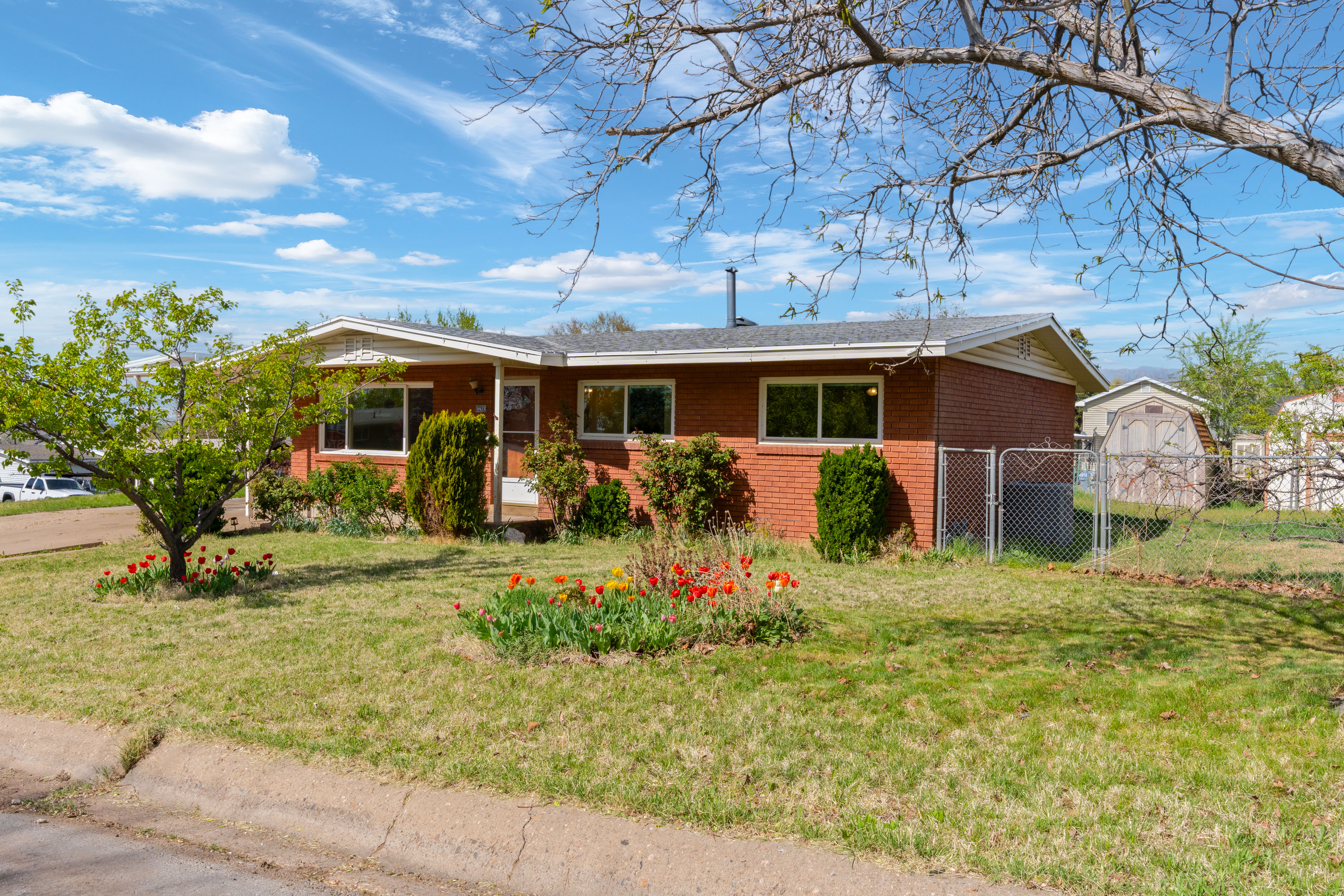 Ranch-style home featuring brick siding