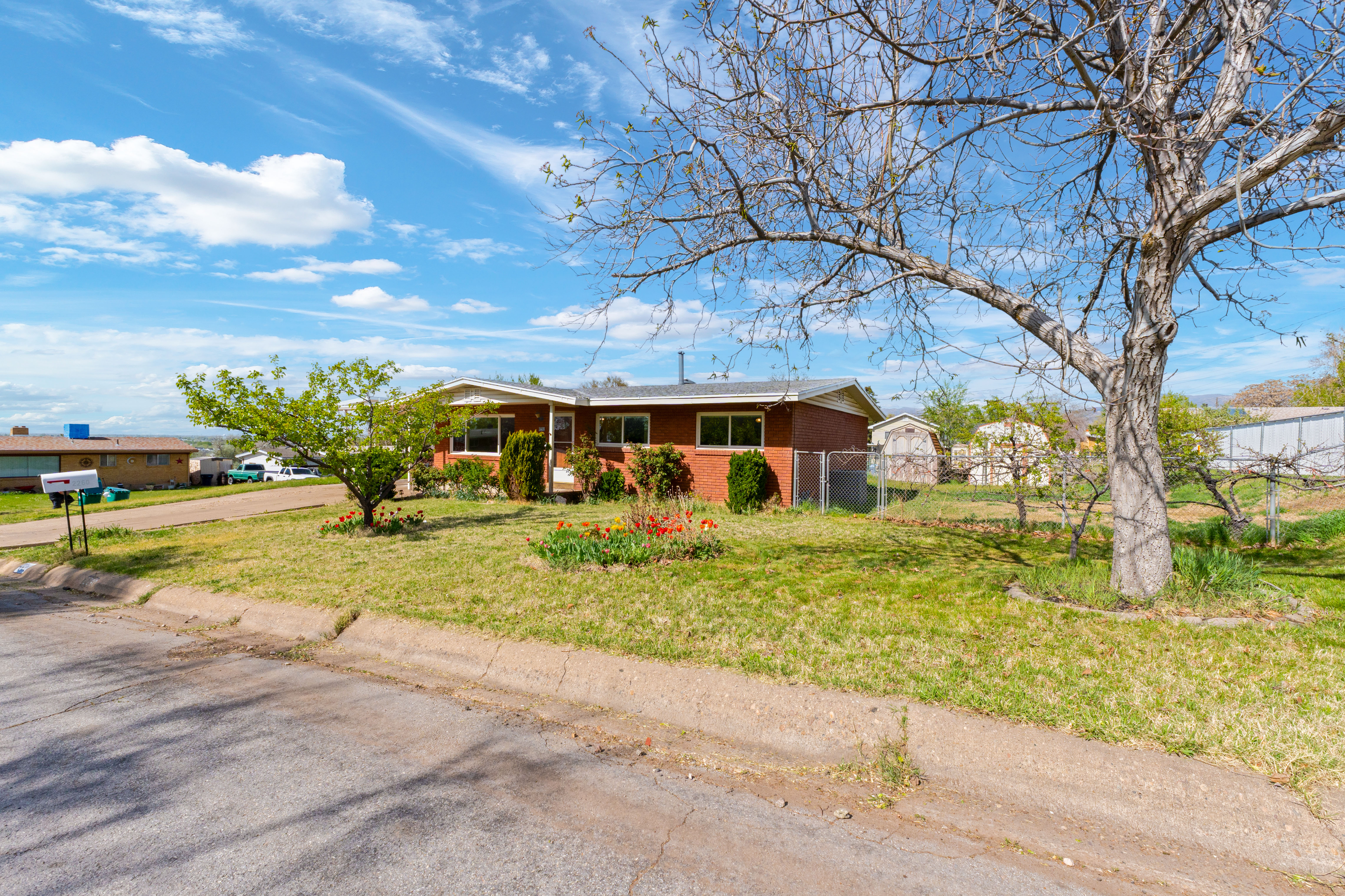 Single story home with brick siding