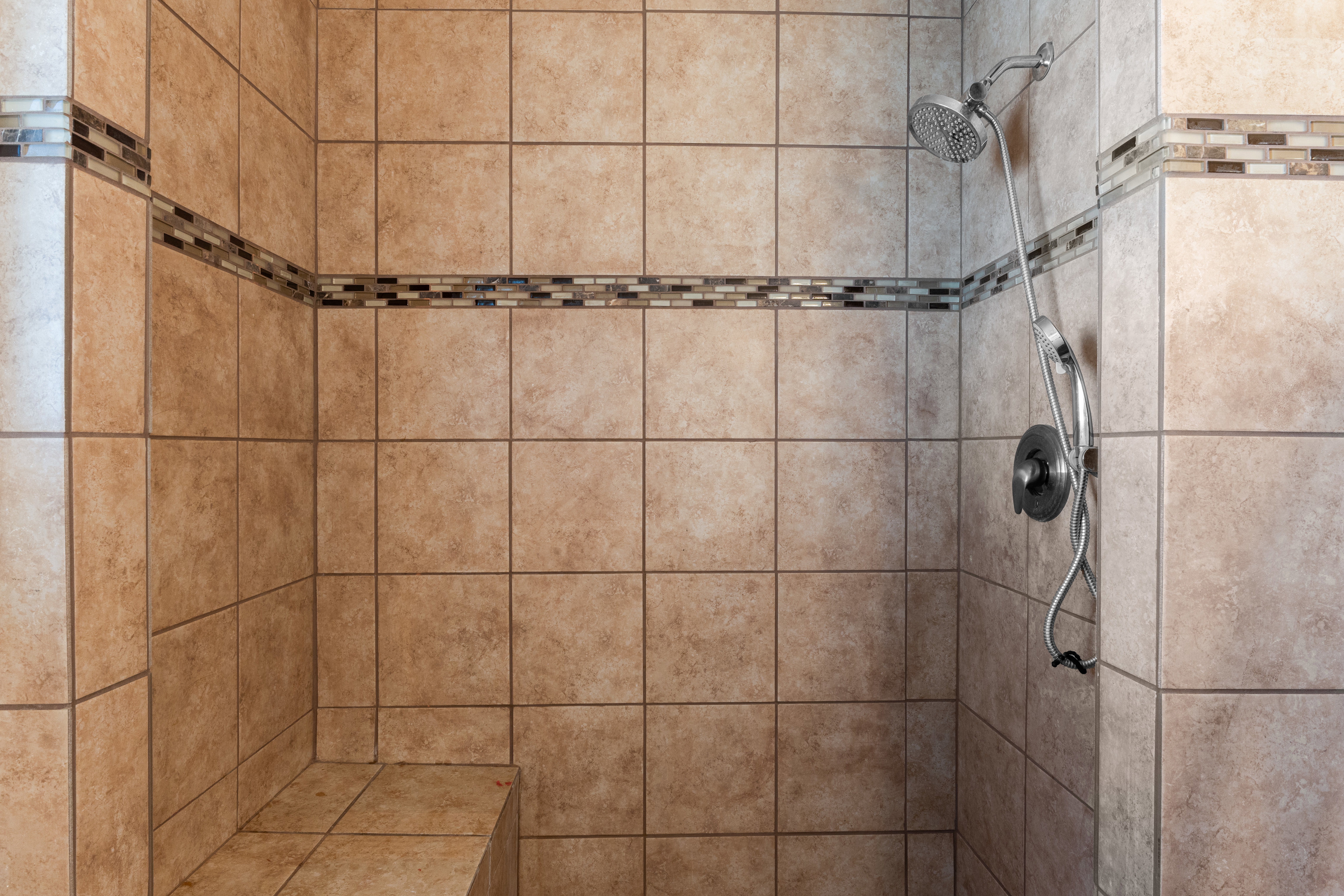 Bathroom view of a tile shower