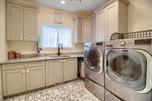 Laundry room with washing machine and dryer and cabinet space