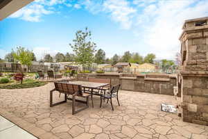View of patio featuring outdoor dining space and a residential view
