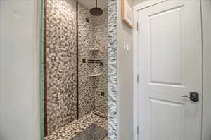 Full bath with a shower stall