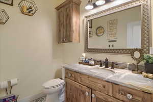 Bathroom with vanity and toilet
