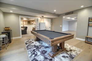 Rec room with light wood-style floors, recessed lighting, pool table, and beverage cooler