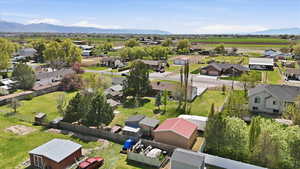 Aerial perspective of suburban area with a mountain backdrop