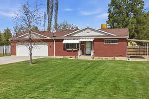Single story home with brick siding, a chimney, concrete driveway, an attached garage, and roof with shingles