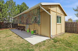 View of outdoor structure with a fenced backyard