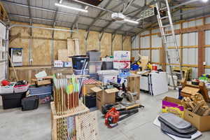 Garage with a garage door opener and metal wall