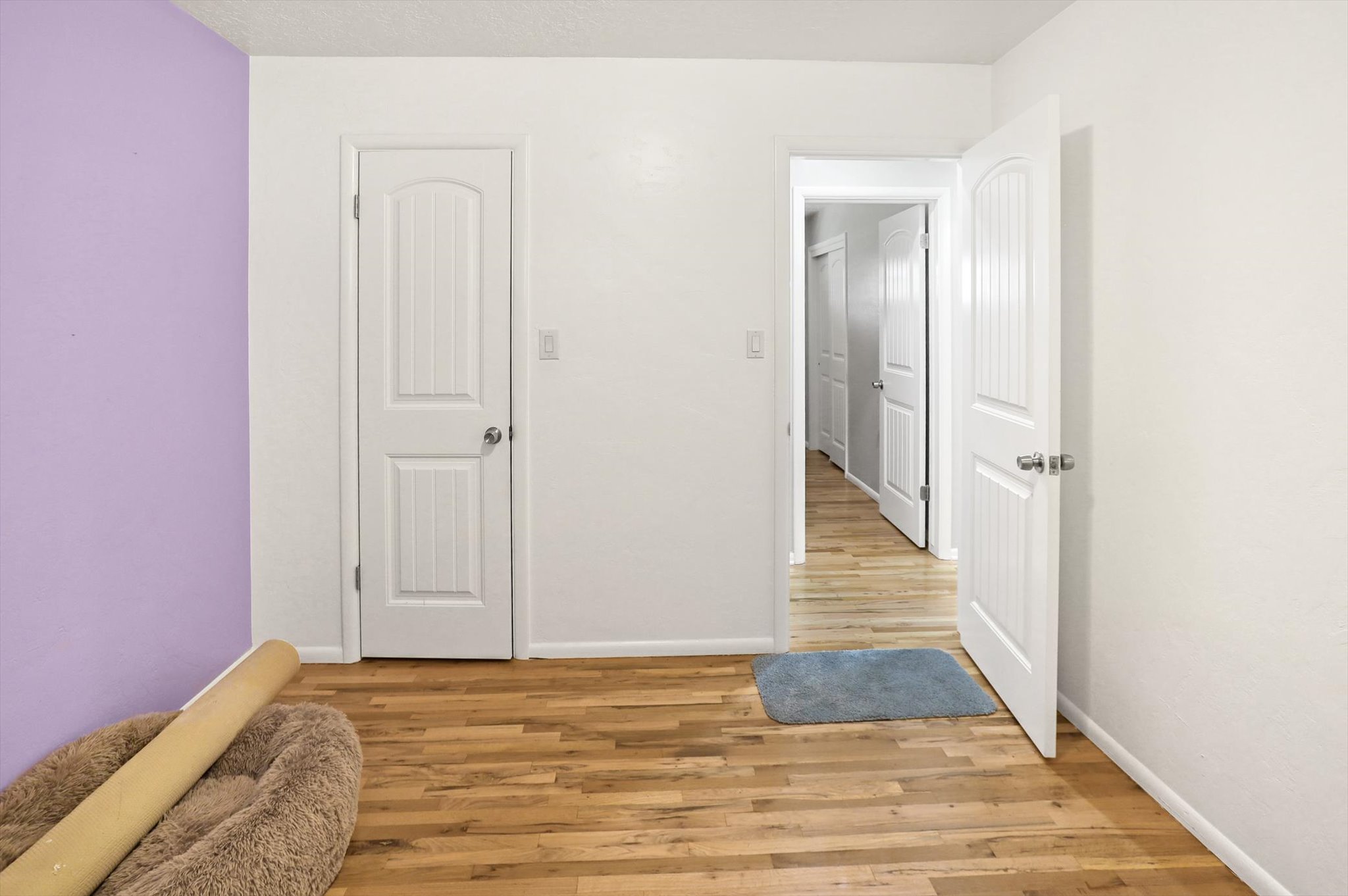 Unfurnished bedroom featuring light wood-style floors