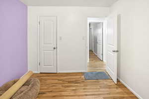 Unfurnished bedroom featuring light wood-style floors