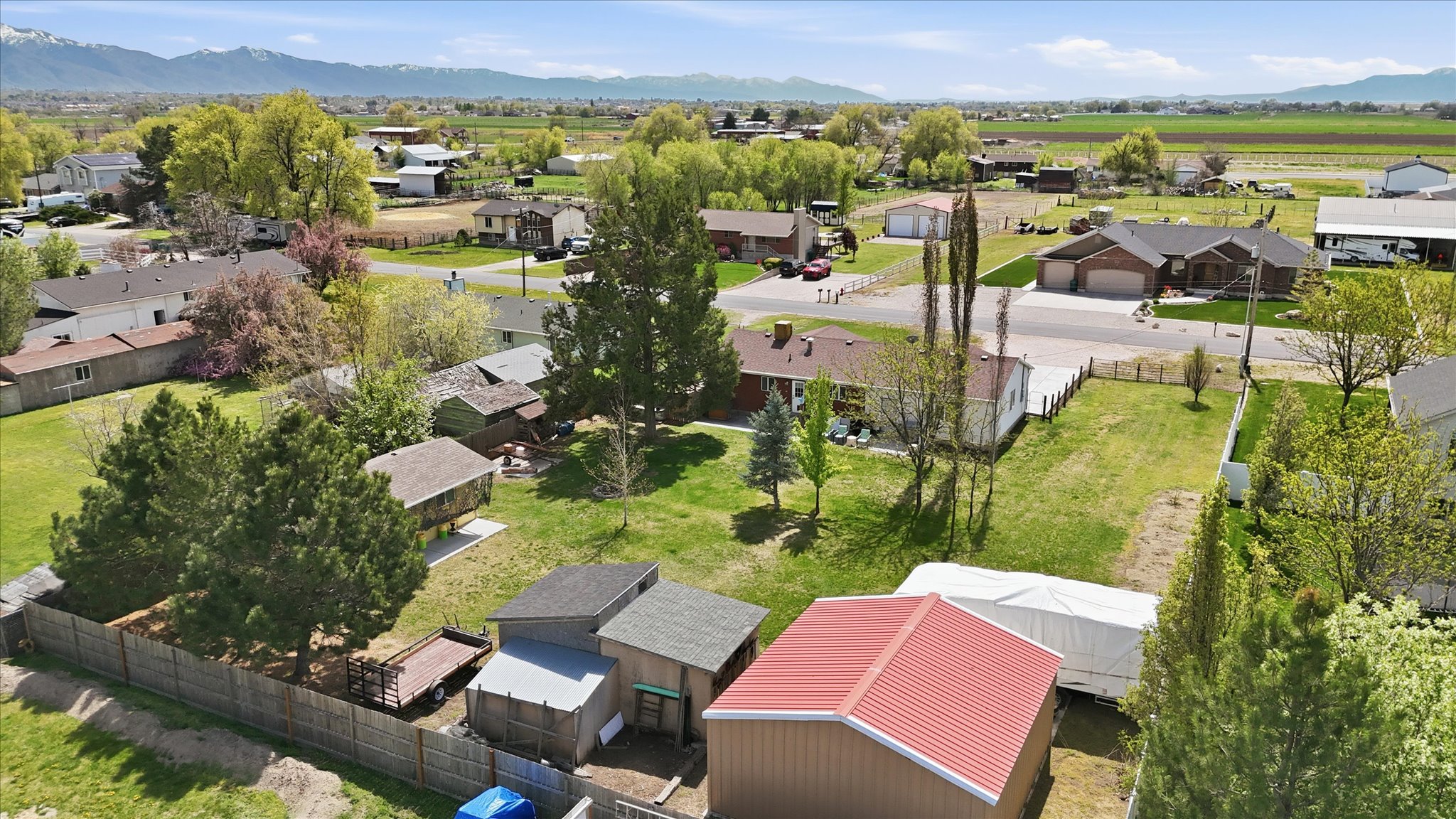 Aerial perspective of suburban area with a mountain backdrop