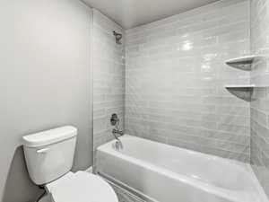 Full bathroom featuring toilet and bathtub / shower combination